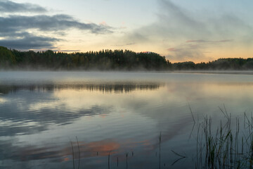 Fototapeta premium Ladoga Skerries National Park near the village of Lumivaara on an early foggy autumn morning, Republic of Karelia, Russia