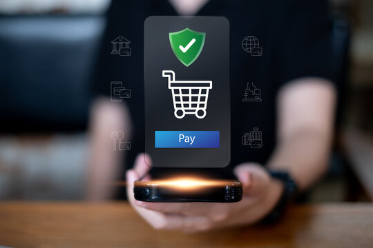 Person holding smartphone online shopping with security payment credit transaction money digital banking commerce e-business finance concept - Powered by Adobe