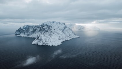Senja panoramic aerial view of snowy mountains along the coast in winter, Norway, natural landscape preservation