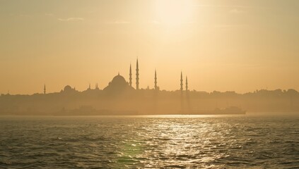 Naklejka premium Turkish mosque silhouette during sunset, cityscape with retro-toned visuals, travel imagery, cultural identification