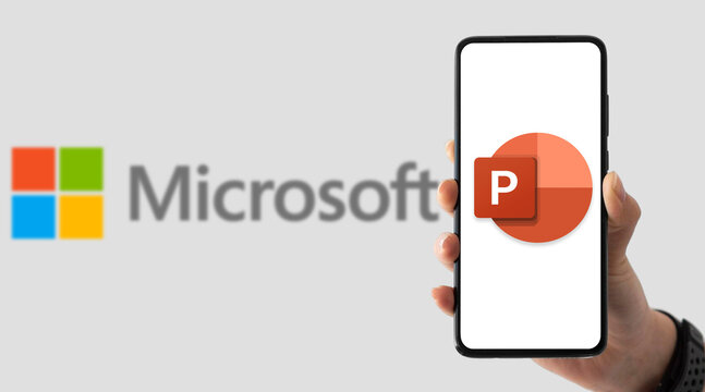 Microsoft PowerPoint app on smartphone with company logo