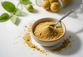 Nutritious amla powder in a bowl with spoon, fresh amla fruits and leaves. amla powder