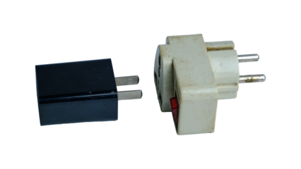 Two Electrical Plugs: Black Two-Prong Plug And White Outlet Adapter For Power Connection