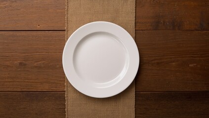 White ceramic plate on wooden tabletop serving as a background for food presentation or menu design