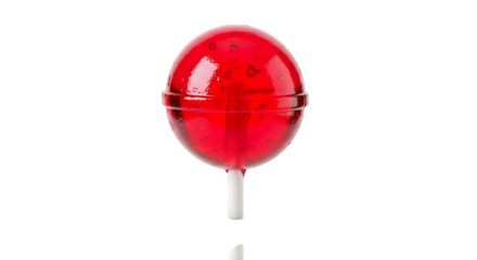 A large red lollipop with a white stick on a black background