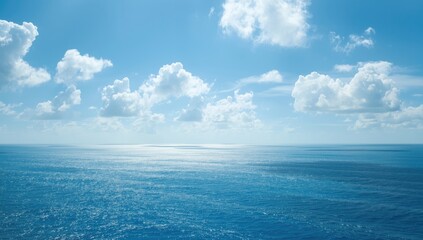 Obraz premium Sky with clouds and ocean of blue, suitable as a calming backdrop for text or interface elements