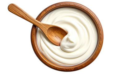 Overhead view of creamy, white dairy product in a wooden bowl with a wooden spoon