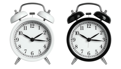Two classic alarm clocks, one white, one black, with hands pointing near 10 past 3
