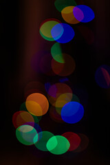 Photo of soft orange and yellow bokeh lights forming a warm abstract background. Defocused glowing circles create a cozy and elegant mood, ideal for design projects