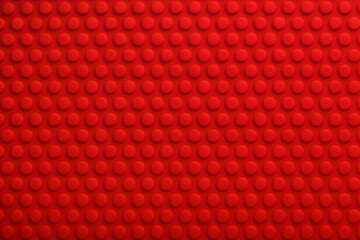 赤い卓球ラバーの突起パターン背景