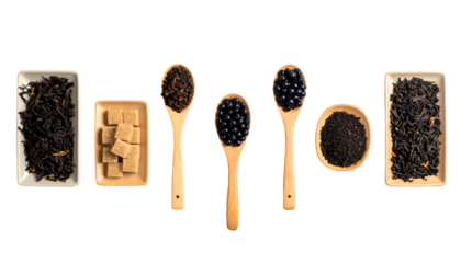 A selection of tea ingredients in containers and wooden spoons against a black backdrop