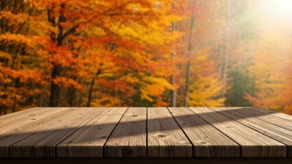 Empty wooden table against blurred autumn forest, dappled sunlight. Warm, seasonal