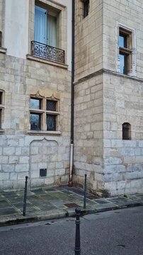 Quiet and historic parisian corner on the ile de la Cite, at the intersection of Rue des Ursins and Rue des Chantres. Reconstructed medieval style buildings with a distinct gothic arched doors