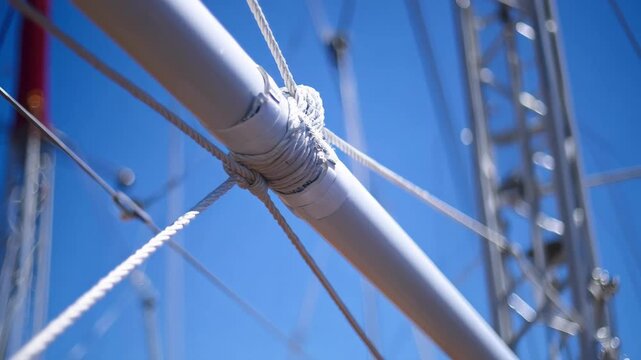 Medium shot of trapeze rigging equipment featuring taut ropes and reinforced bars illustrating the precision and safety in place for highflying acrobatics.