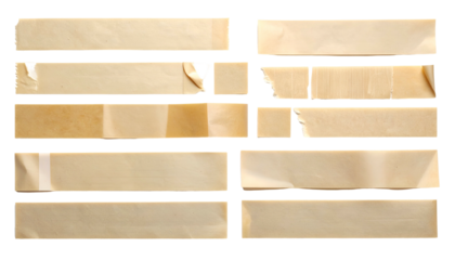 Close-up of various tan, torn tape pieces arranged against a black background