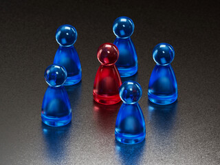 Standout Red Token: Contrast in a Group of Blue Game Pieces