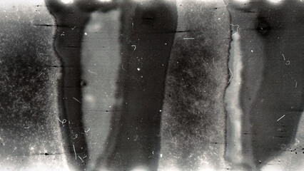Blank grained film strip texture background with heavy grain, dust and light leak. Old expired moldy photographic film scan.