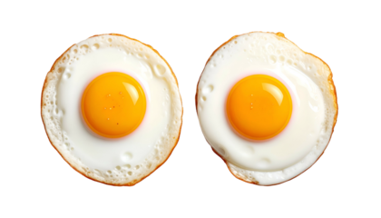 Two fried eggs, sunny side up, isolated on a black background