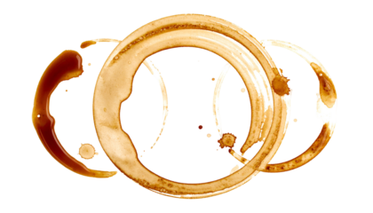 Three interconnected coffee ring stains on a black background, with varied shapes