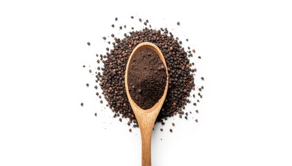 Close-up of black pepper grains scattered on a white surface for culinary use