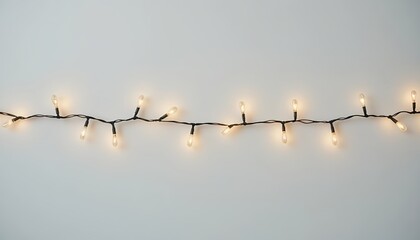 Simple fairy light string decoration with small bulbs, minimal curved line isolated on white background for clean festive overlays

