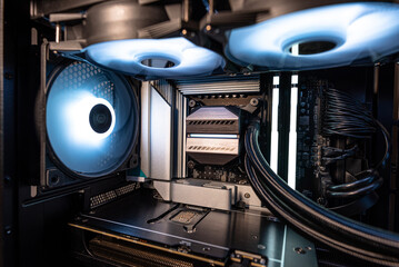 The inside of a modern computer assembled in 2025, showing DDR5 memory and other components.