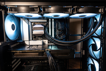 The inside of a modern computer assembled in 2025, showing DDR5 memory and other components.