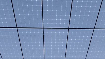 Drone view of solar panels on a rooftop during morning frost, with photovoltaic panels covered in frost or light snow.