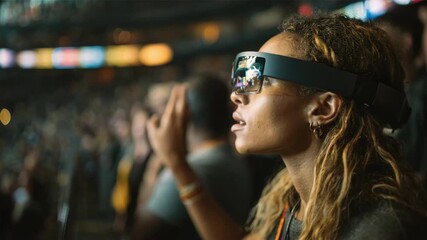Medium shot of a fan wearing augmented reality glasses interacting with digital content showcasing immersive AR technology enhancing fan engagement in live events.