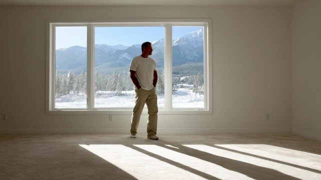 Medium shot of a worker installing doubleglazed energyefficient windows highlighting improved climate control and insulation benefits in a modern residential setting.