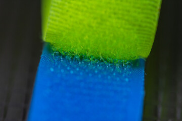 green  blue a Velcro-type fastener (also known as a hook-and-loop fastener). This is a macro view showing how the two parts snap together