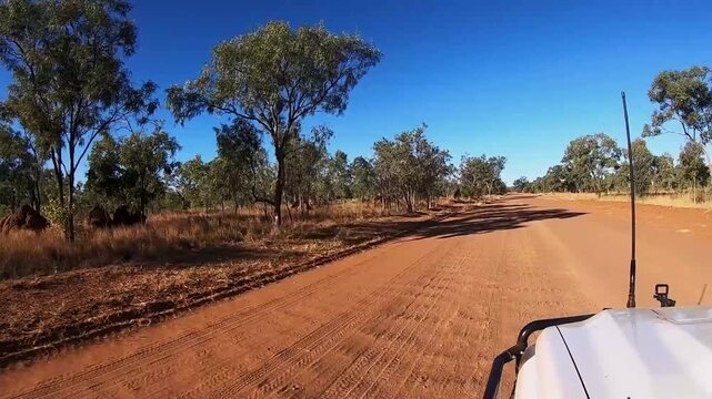 Sunset offroad driving with a 4WD on an Australian outback gravel road