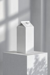 Minimalist white milk carton on a textured pedestal, illuminated by soft natural light in a serene setting. Milk carton mockup