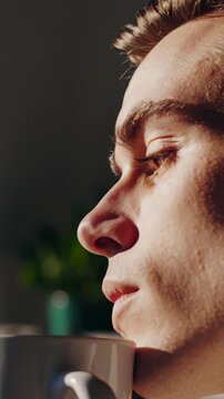 Vertical video, profile shots of a caucasian man in a grid format, creating a striking montage that highlights themes of repetition and pattern in contemporary portrait photography