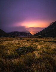 Mountain pass under a dramatic sunset glow