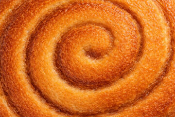 シナモンロールの渦巻き焼き面のマクロ質感背景