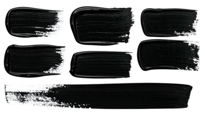 Seven black paint brushstrokes on a transparent background, varying shapes & sizes