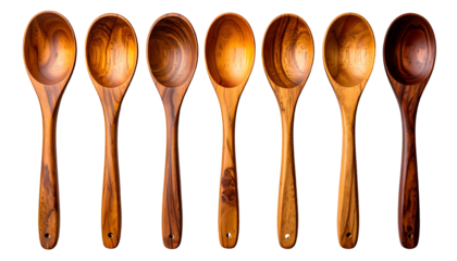 Seven wooden spoons arranged horizontally on a black background, showing varying wood grains