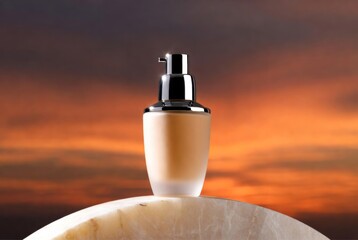 bottle of perfume on the beach