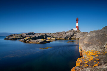 view of the Eigeroy Lighthouse on the small island of Midbrodoya near Eigersund in southern Norway