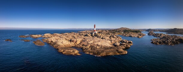 drone panorama view of the Eigeroy Lighthouse on the small island of Midbrodoya near Eigersund in southern Norway