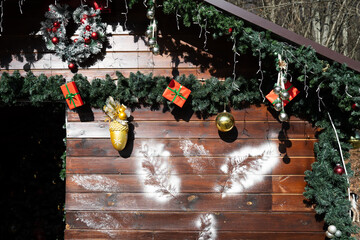Wooden house decorated for Christmas .  Festive and warm home vibe