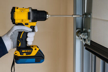 Worker Using Cordless Drill to Install Metal Frame Structure