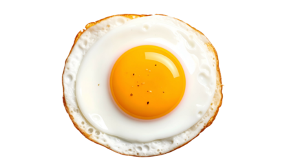 Perfectly fried egg on black, overhead view. Bright yolk, cooked whites