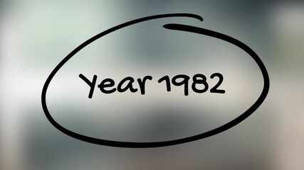 Year 1982 Handwriting with Black Marker on Glass Surface