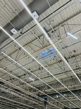 Warehouse Illuminated With Energyefficient Lights, Industrial Facilities Equipped With Large Windows And Energysaving Lighting To Maximize Natural And Artificial Illumination