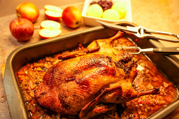 Traditional roast duck, fresh from the oven. The roast is often stuffed with apples, onions, marjoram, and mugwort. Typical side dishes are red cabbage and dumplings.