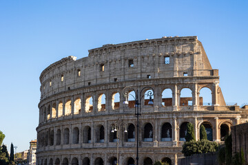 Fototapeta premium Many tourists visit the Colosseum, also known as the Flavian Amphitheater from the time of the Roman Empire, built in the 1st century, located in Rome, Italy.