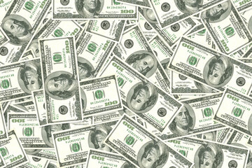 Background of scattered one hundred US dollar bills money texture