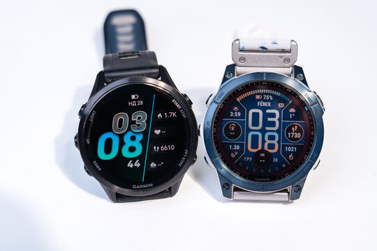28.12.2025 - Kyiv, Ukraine: Garmin Fenix 7 Saphire Solar blue color vs Garmin Forerunner 970